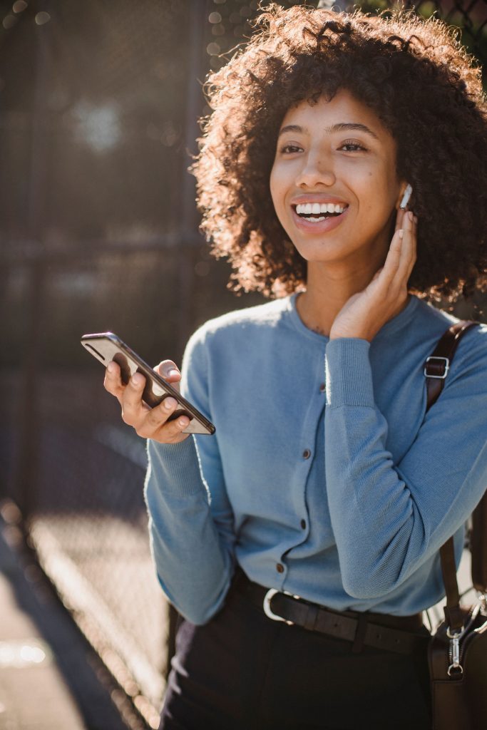 woman learning Greek on her phone outdoors